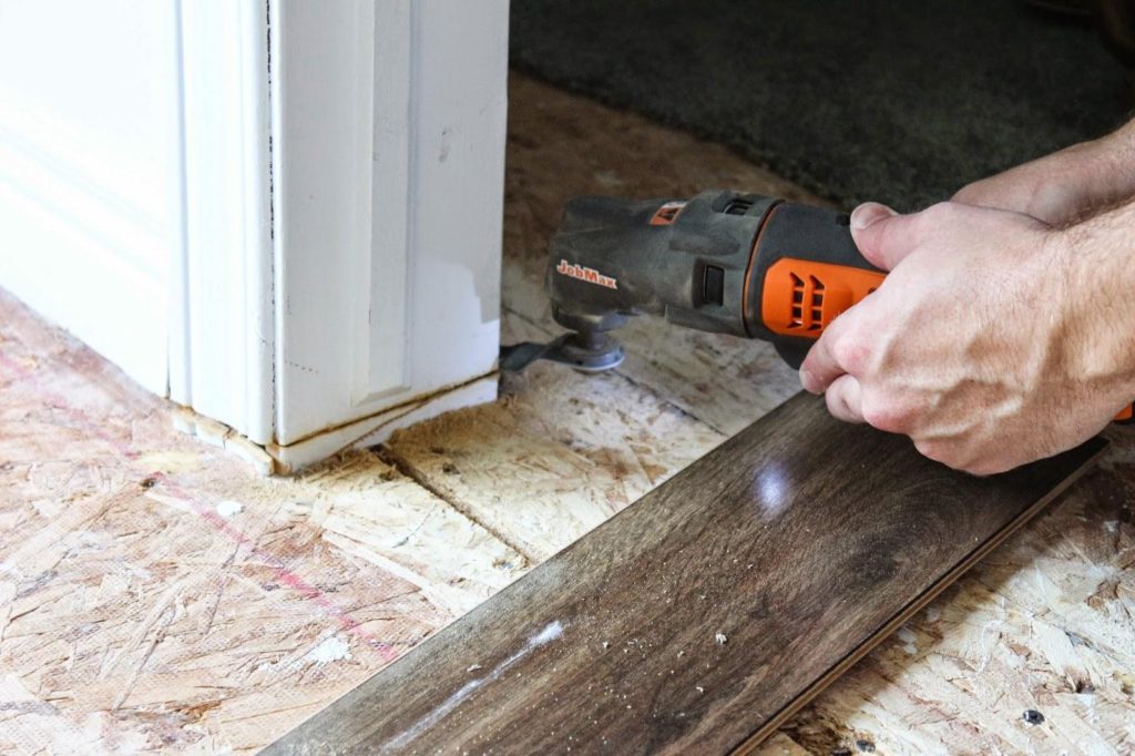 Using a multi-tool to cut door jambs